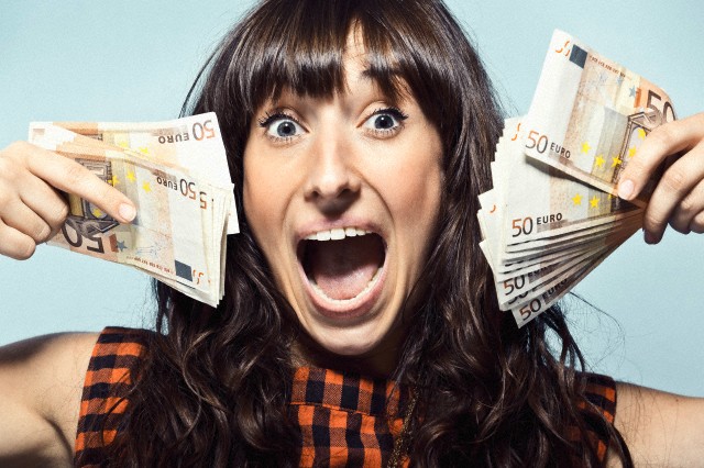 Woman holding Euro bills